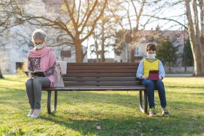 Grandmother and grandson separated by social distancing Grandmother and grandson separated by social distancing