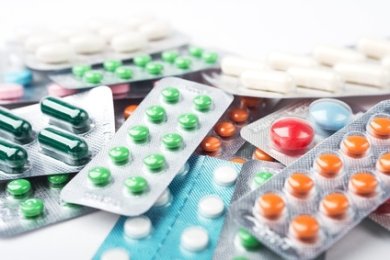 Pile of colorful medicine pills and capsules in blister packs Pile of colorful medicine pills and capsules in blister packs