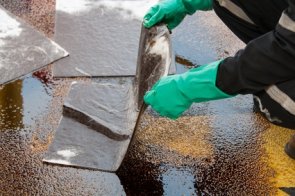 oil spill cleanup on working area. danger for the nature. oil spill cleanup on working area. danger for the nature.