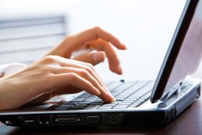 Image of female hands on the keys typing documents 112180100000033363.jpg