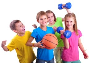 Group of sporty children friends with dumbbells and ball