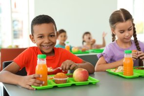 Children sitting at table and eating healthy food during break at school 112180100000067207.JPG