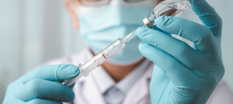 vaccines fight against virus covid-19 corona virus, doctor or scientist in laboratory holding a syringe with liquid vaccines for children or older adults,Concept:diseases,medical care,science.