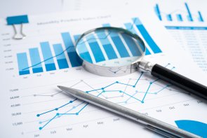 Magnifying glass on charts graphs paper. Financial development, Banking Account, Statistics, Investment Analytic research data economy, Stock exchange trading, Business office company meeting concept. Magnifying glass on charts graphs paper. Financial development, Banking Account, Statistics, Investment Analytic research data economy, Stock exchange trading, Business office company meeting concept.
