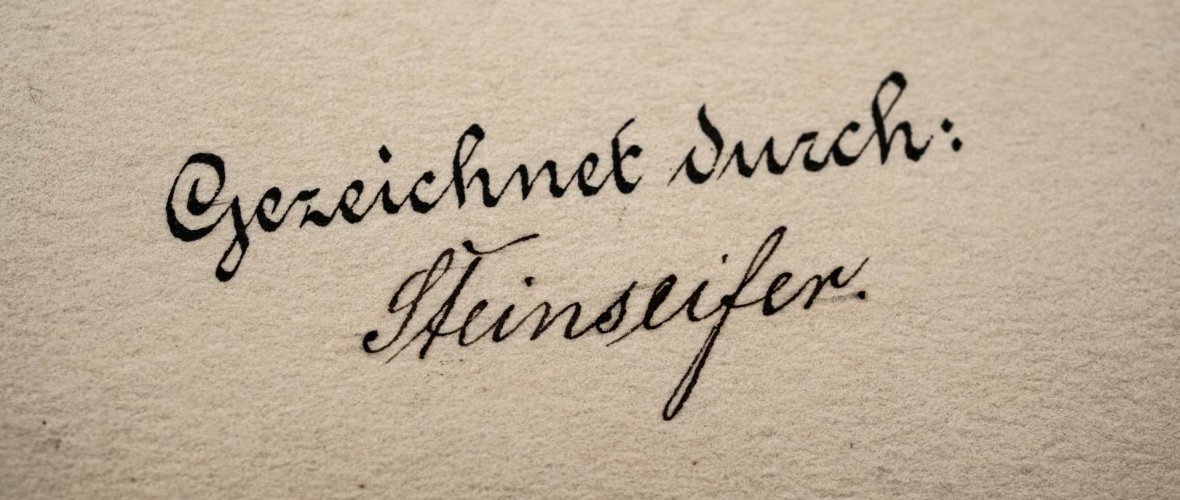 Vergrößerter Schriftzug "Gezeichnet durch" aus einer Karte